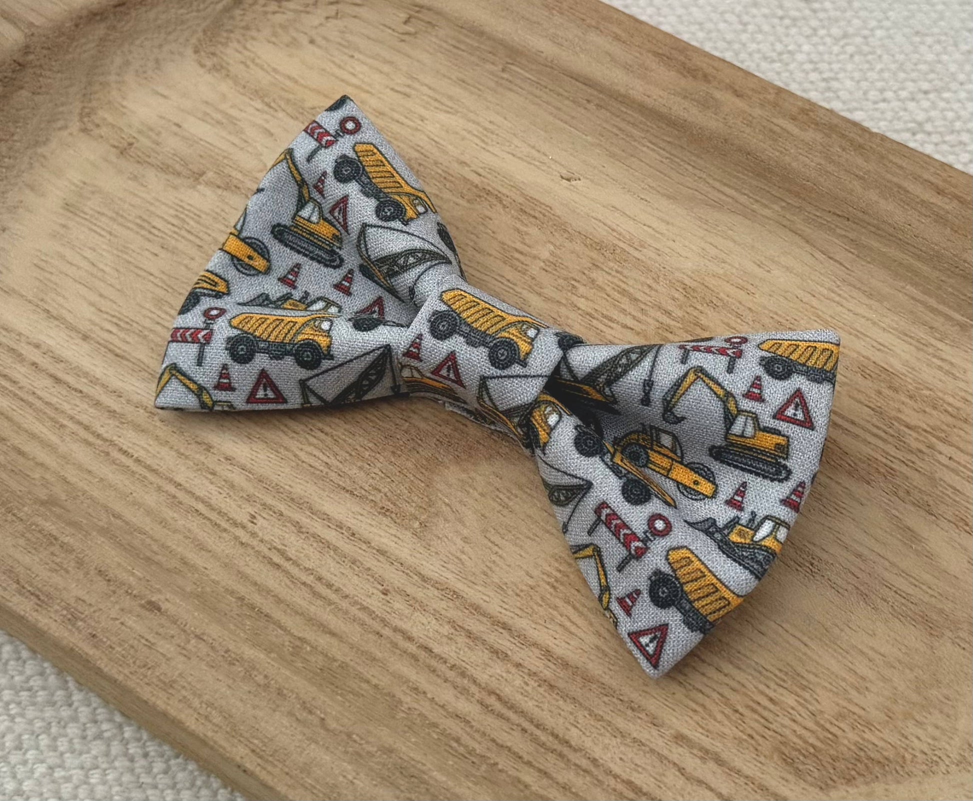 Bow tie with yellow construction vehicle pattern