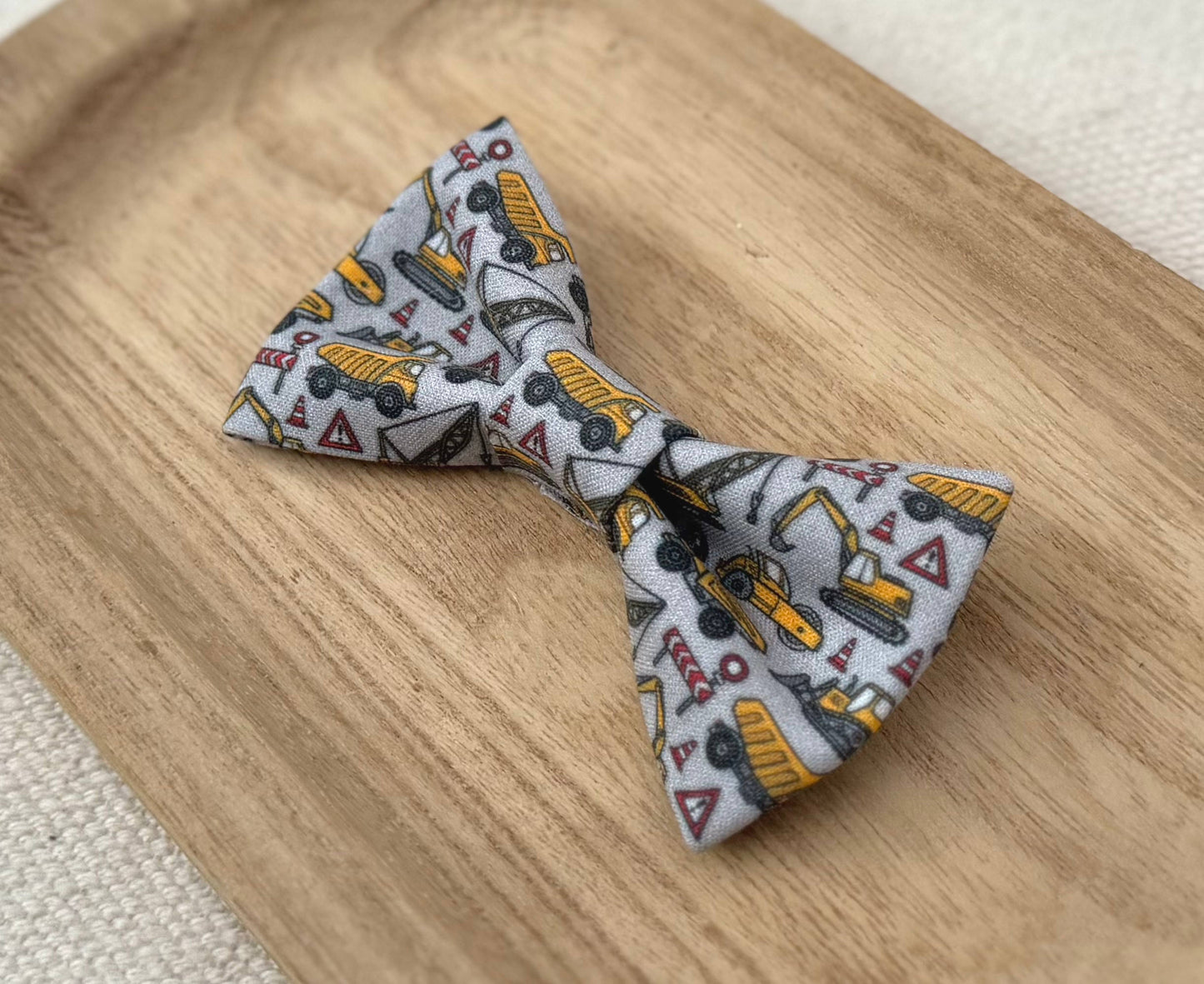 Bow tie with yellow construction vehicle pattern