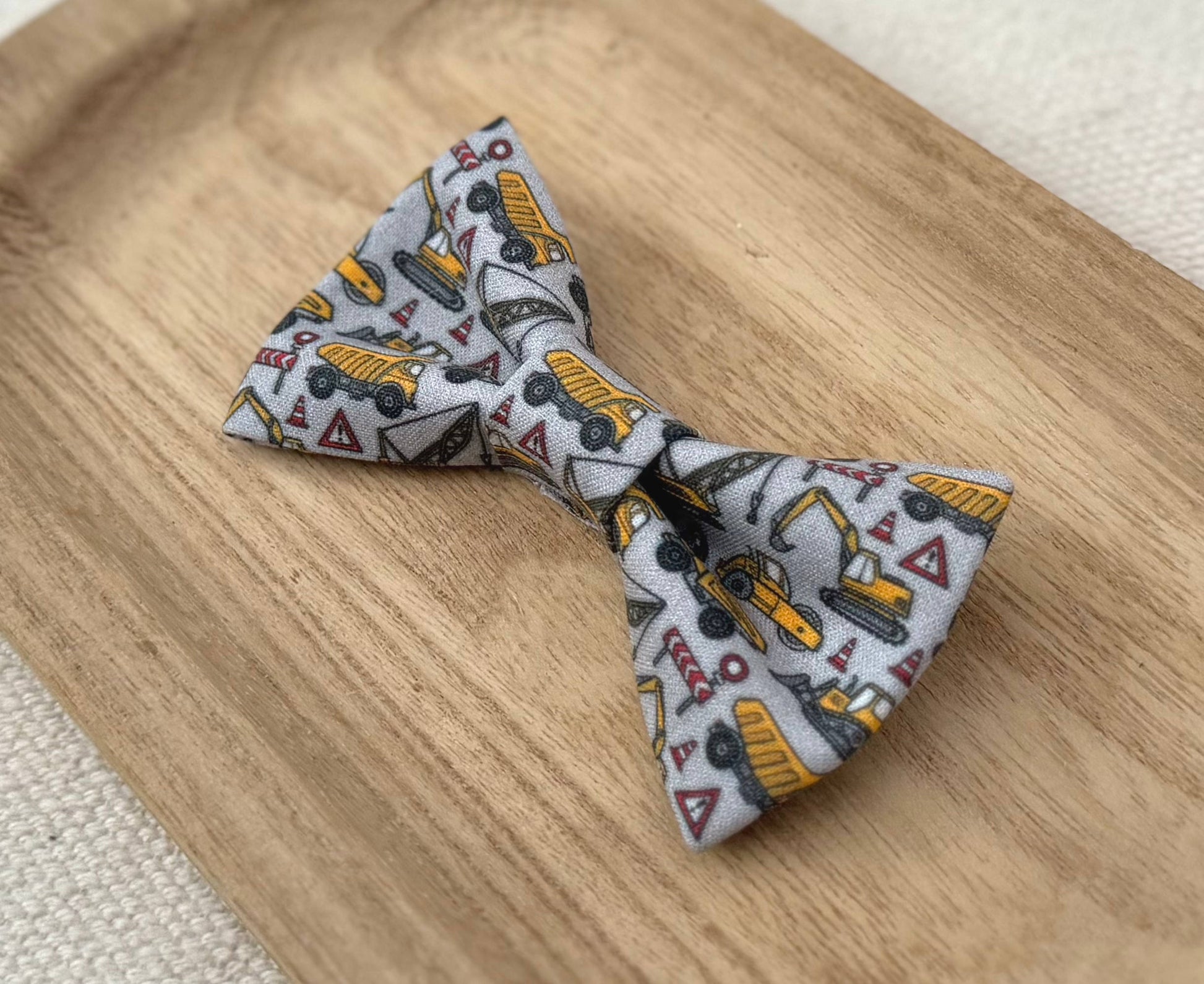 Bow tie with yellow construction vehicle pattern